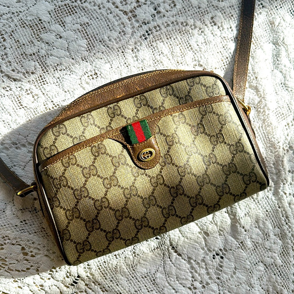 Gucci crossbody purse , light tear on strap , some pen stains inside purse